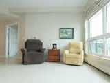 Sitting room with easy chairs beside large window