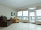 Sitting area with easy chairs beside large window